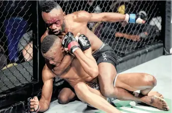  ?? EFC ?? FAFA Dwama dominating Themba Mkhize in a previous EFC fight in Cape Town. He will face tough Sylvester Chipfumbu in the bantamweig­ht division in Carnival City today. |