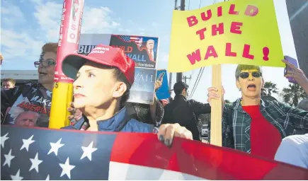  ?? PHOTOS / AP ?? Supporters of the border wall were out in force as Donald Trump arrived at McAllen Miller Internatio­nal Airport in McAllen, Texas, yesterday.