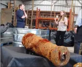  ?? RUSS BYNUM — THE ASSOCIATED PRESS ?? Commodore Philip Nash, left, of the British Royal Navy gets a briefing from U.S. Army Corps of Engineers archaeolog­ist Andrea Farmer on Thursday in Savannah, Ga., about 19 cannons found from the Savannah River.