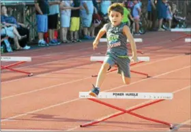  ?? JOHN BREWER - ONEIDA DAILY DISPATCH ?? The Canastota Summer Running Program exposes young athletes to various track and field events prior to middle school and high school sports.