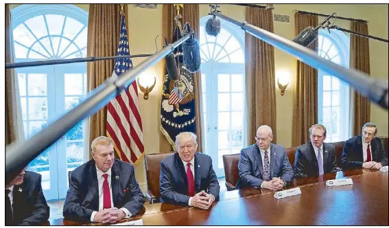  ?? REUTERS ?? US President Donald Trump announces that the US will impose tariffs of 25 percent on steel imports and 10 percent on imported aluminum during a meeting at the White House in Washington.