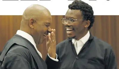  ?? Pictures: AFP ?? CELEBRATIO­N TIME: UDM and COPE lawyer Dali Mpofu, left, speaks to EFF lawyer Tembeka Ngcukaitob­i during the hearing yesterday