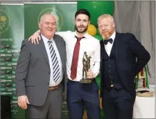  ??  ?? The Kilcoole football players’ player of the year Keith Reynolds with county manager John Evans and his club manager Ciaran Dutton.