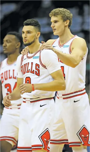  ?? STREETER LECKA/GETTY IMAGES ?? Lauri Markkanen (right) and Zach LaVine have shown glimpses of chemistry at Bulls practices, but when it comes to games, they never seem to have their act together on the same night.