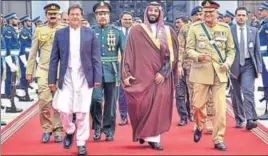  ?? AFP ?? Pakistan's Prime Minister Imran Khan and Army Chief Qamar Javed Bajwa walk along with Saudi Arabian Crown Prince Mohammad bin Salman on his departure on Monday.