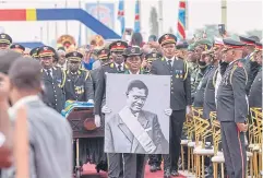  ?? AFP ?? The procession carrying slain Congolese independen­ce hero Patrice Lumumba’s only surviving remains arrives at the Limete Tower in Kinshasa on Thursday.