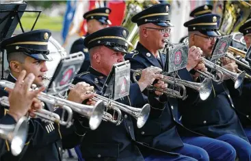  ?? Kin Man Hui / San Antonio Express-News ?? The 323rd Army Band performs during a retirement ceremony last month at Fort Sam Houston. Band supporters say the groups raise soldier morale and bridge the gap between civilians and the military.