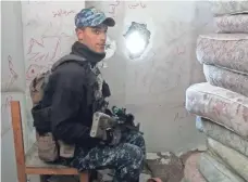  ?? IGOR KOSSOV, SPECIAL FOR USA TODAY ?? Yousef Ali, 20, takes up his position in an abandoned hotel as the fighting continues on the edge of western Mosul’s Old City.