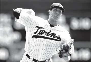  ?? Associated Press ?? ■ Minnesota Twins pitcher Kyle Gibson throws against the Baltimore Orioles in the first inning of a baseball game Saturday in Minneapoli­s.