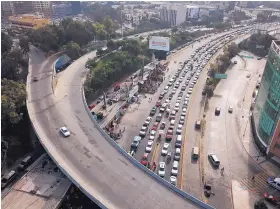  ?? RODRIGO ABD/ASSOCIATED PRESS ?? Drivers wait to cross the Mexico-U.S. border from Tijuana, Mexico, Monday. The United States closed off northbound traffic for several hours.