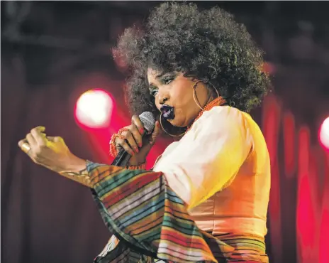  ?? WireImage; Getty ?? Oumou Sangere in Rotterdam in July: she has recently updated her once-traditiona­l sound to appeal to a new audience