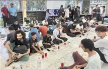  ?? ?? Togetherne­ss: MMU students waiting to break fast at Surau Al-hidayah in MMU Cyberjaya campus recently.