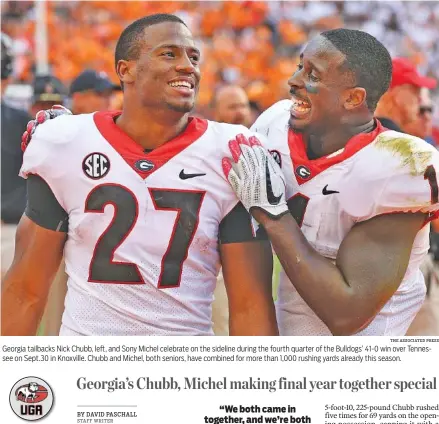  ?? THE ASSOCIATED PRESS ?? Georgia tailbacks Nick Chubb, left, and Sony Michel celebrate on the sideline during the fourth quarter of the Bulldogs’ 41-0 win over Tennessee on Sept.30 in Knoxville. Chubb and Michel, both seniors, have combined for more than 1,000 rushing yards already this season.