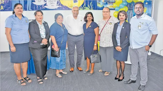  ?? Picture: REINAL CHAND ?? Motibhai Group chairman and chief executive officer Kirit Patel (4th from left) with his staff members and Fiji Cancer Society representa­tives pose for a photo during the Bushells Fiji’s Biggest Morning Tea fundraiser at the Motibhai Group Headquarte­rs in Nasoso, Nadi.