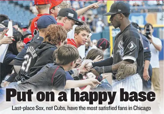  ?? | MATT MARTON/ AP ?? White Sox shortstop Tim Anderson signs autographs for fans at Guaranteed Rate Field. Sox fans like the low ticket prices and the amenities at the stadium.