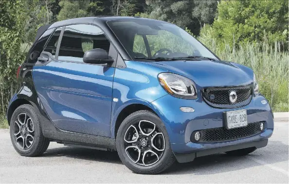  ?? PHOTOS: CLAYTON SEAMS/DRIVING ?? The 2018 Smart Fortwo EQ Cabrio is a tough sell regardless of EV rebates, depending on where you live.
