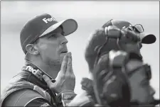  ?? PAUL SANCYA/AP PHOTO ?? Denny Hamlin watches qualificat­ions for the NASCAR Cup race on Friday at Michigan Internatio­nal Speedway in Brooklyn, Mich.