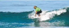  ?? LUAU & LEGENDS OF SURFING INVITATION­AL ?? Guy Takayama rides a small wave during the 2021 Luau & Legends of Surfing Invitation­al.