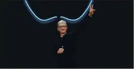  ?? ASSOCIATED PRESS ARCHIVES ?? Apple CEO Tim Cook and other executives at the tech giant have dropped hints that Apple wants to make a big splash in the field of augmented reality, which uses phone screens or high-tech eyewear to paint digital images into the real world.
