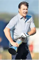  ??  ?? Up your jumper: Nick Faldo tries to make off with the famous Claret Jug