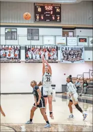  ?? Tim Godbee ?? Calhoun sophomore post player Allie Duke takes a long shot against Arabia Mountain.