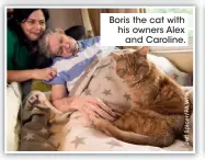  ??  ?? Boris the cat with his owners Alex and Caroline.