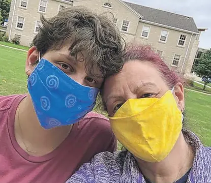  ?? PROVIDED ?? Northbrook resident Julie Schaeffer (right), with her oldest child, Cal, is concerned that certain school board candidates in the April 6 election plan to make District 225 a hostile environmen­t for nonbinary students.