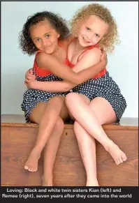  ??  ?? Loving: Black and white twin sisters Kian (left) and Remee (right), seven years after they came into the world