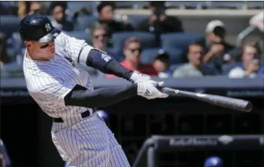  ?? ASSOCIATED PRESS ?? New York Yankees’ Aaron Judge connects for a two-run home run against the Toronto Blue Jays during the third inning of a baseball game, Saturday in New York.