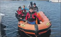  ??  ?? Cdt Callum Neil at the helm with Cdt William Sykes preparing to secure alongside at Muirtown Basin, Caledonia Canal after completing their RYA Power level 1.