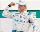  ?? Jared C. Tilton / Getty Images ?? Austin Hill celebrates in victory lane after winning the Xfinity race at Atlanta Motor Speedway. Hill grew up in a small town abut an hour from the track.