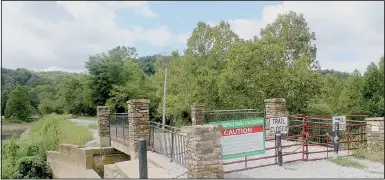  ?? (NWA Democrat-Gazette/Keith Bryant) ?? The Lake Bella Vista dam remains closed after rain earlier this year washed out large portions of it.