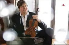  ??  ?? Conductor and violinist Joshua Bell performs alongside the St. Martin in the Fields Orchestra on Monday night.