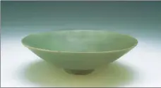  ??  ?? Cultural relics recovered on Nanhai One, such as a porcelain bowl (left) produced in Longquan kiln, Zhejiang province, gold bracelets (center) and a balance with counterwei­ghts (right), show the prosperous trade along the Maritime Silk Road in the Southern Song Dynasty (1127-1279).