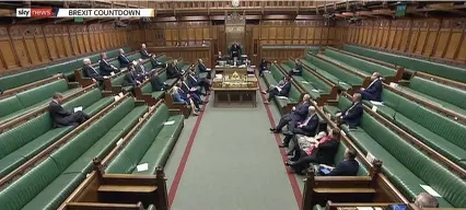  ??  ?? Deputy Speaker Nigel Evans, left, announces to a half-empty House of Commons that the Queen has given the Withdrawal Agreement Royal Assent
