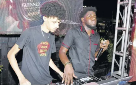  ?? (Photo: Joseph Wellington) ?? DJ Kryptic Live (left) and DJ Fyahman at the controls