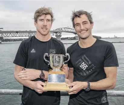  ?? PHOTO: GETTY IMAGES ?? Dominant duo . . . New Zealand Olympic sailors Peter Burling (left) and Blair Tuke pose with the Lonsdale Cup at the Royal New Zealand Yacht Squadron in Auckland yesterday.