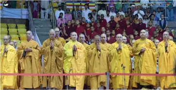  ?? — PTI ?? Buddhist monks observe silence in memory of the victims of the recent earthquake in Nepal and India at Internatio­nal Buddha Purnima Divas celebratio­ns 2015 in New Delhi on Monday.