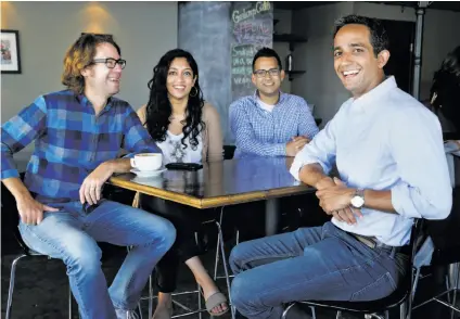 ?? Photos by Paul Chinn / The Chronicle ?? Manik Suri (right), CEO of MeWe, meets with developmen­t and marketing team members Andrew Hager (left), Sundas Arain and Ranjeet Sidhu, chief technical officer. The startup makes a food-inspection app called CoInspect, below.