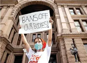  ?? The Associated Press ?? ■ Jillian Dworin participat­es in a protest against the six-week abortion ban Sept. 1, 2021, at the Capitol in Austin, Texas. Young people on social media have found a way to protest Texas’ new law banning most abortions by focusing on a website establishe­d by the state’s largest anti-abortion group that takes in tips on violations.