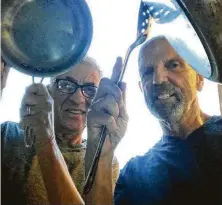  ?? Courtesy photo ?? John Dascoulias, left, and Clifford Pugh broadcast their nightly pots-and-pan clanging session on Facebook Live.