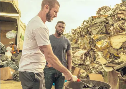  ?? COURTESY OF STX FINANCING, LLC ?? Pablo Schreiber, left, and Curtis “50 Cent” Jackson star in “Den of Thieves.”