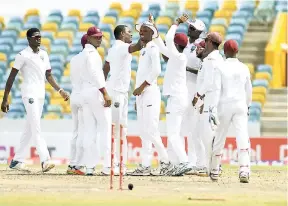  ?? FILE ?? West Indies players celebrate a Pakistan wicket during the recent Brighto Paints Q Mobile Cup second Test at Kensington Oval, Barbados.