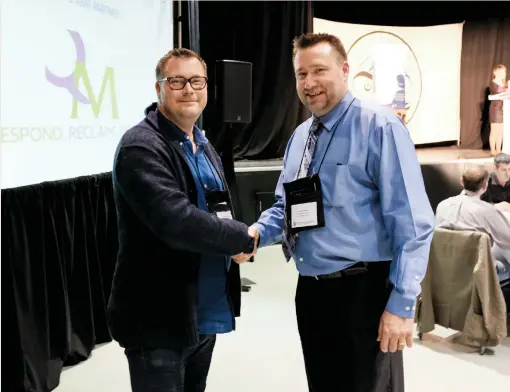  ??  ?? Colin Doylend (left) and Conrad Browne (right), only a few minutes after the announceme­nt of their partnershi­p on the Aboriginal Business Match 2017 tradeshow floor.