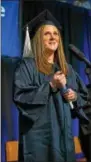  ?? SUBMITTED PHOTO ?? Havertown resident Erin Johnson collects her bachelor’s degree in business at Penn State Brandywine’s fall commenceme­nt ceremony.