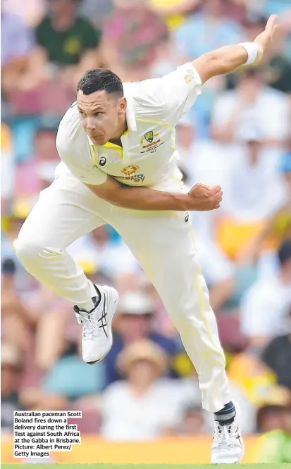  ?? ?? Australian paceman Scott Boland fires down a delivery during the first Test against South Africa at the Gabba in Brisbane. Picture: Albert Perez/ Getty Images