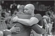  ?? AP-John Bazemore, File ?? Atlanta Hawks guard Vince Carter, right, hugs former Hawk Dominique Wilkins as he leaves the court following an NBA basketball game against the New York Knicks on March 11 in Atlanta.