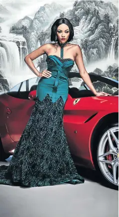  ?? Picture: NICK BOULTON ?? TV personalit­y Bonang Matheba uses a Ferrari to stay steady in a body-hugging, jewel-encrusted dress from designer Gert-Johan Coetzee’s Spring/Summer 2017 collection. The collection will be on show at the Saxon Hotel in Johannesbu­rg during South...