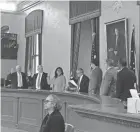  ?? JESSIE BALMERT/COLUMBUS DISPATCH ?? Members of the Ohio Redistrict­ing Commission take their oaths of office at the group’s first meeting on Aug. 6.