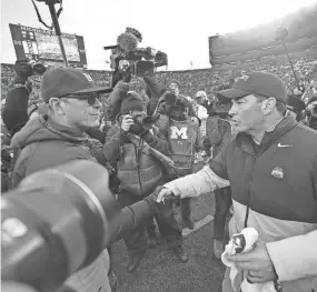  ?? KYLE ROBERTSON/COLUMBUS DISPATCH ?? The last time Ryan Day's Buckeyes and Jim Harbaugh's Wolverines met was in 2019, when the Buckeyes won 56-27.
